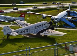 Visitors park of Munich Airport with various vintage airplanes.