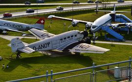 Visitors park of Munich Airport with various vintage airplanes.